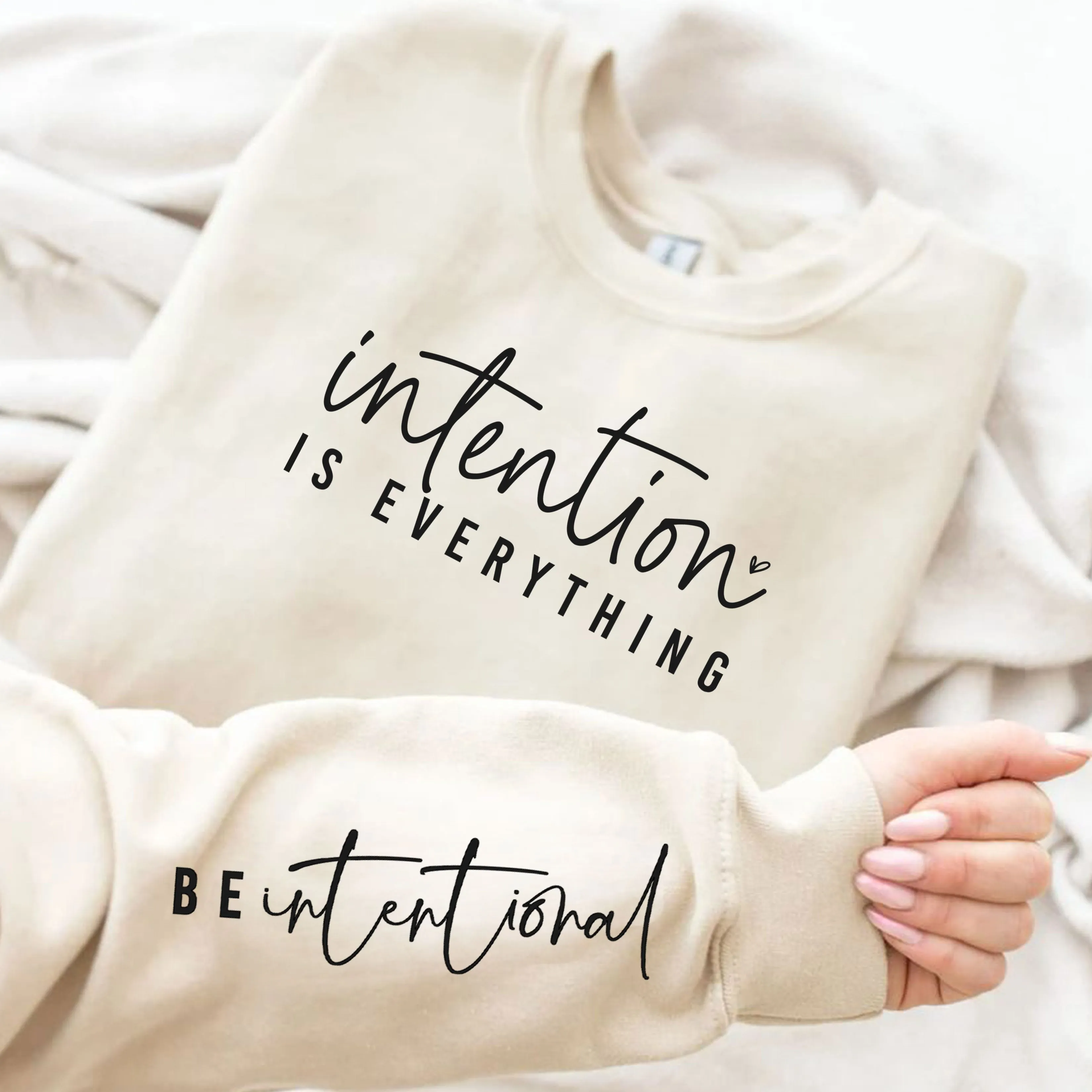 Intention Is Everything Be Intentional Sweatshirt with sleeve quote